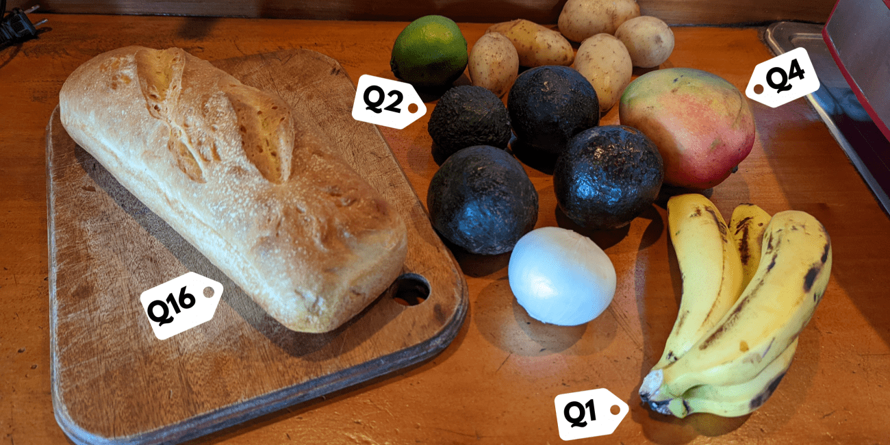 Picture of a loaf of bread, avocados, bananas, potatoes, a mango, an onion, and a lime.