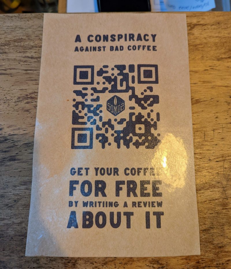 A flyer asking visitors to review their restaurant for a free coffee.